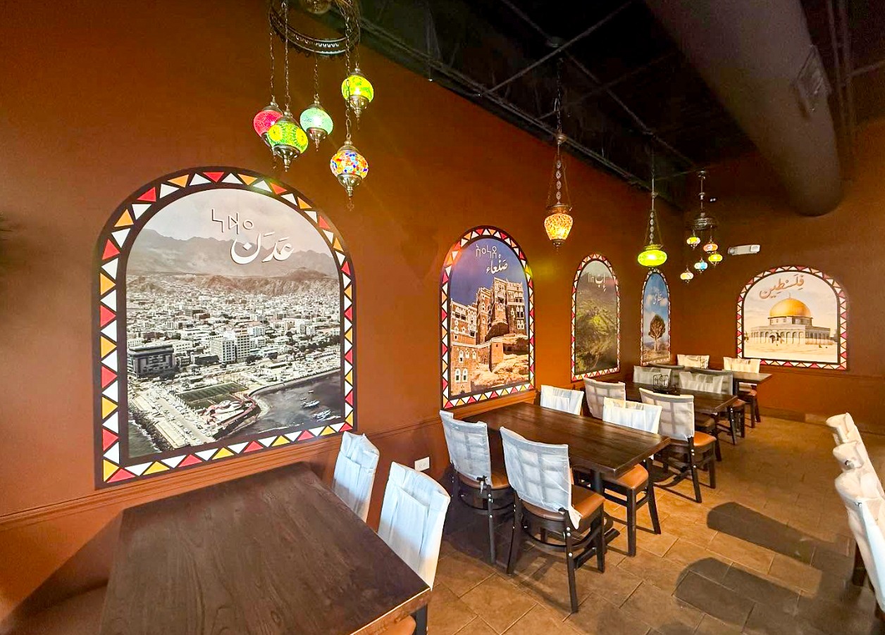 Al Yemen Al Saeed interior with custom framed cultural wall graphics