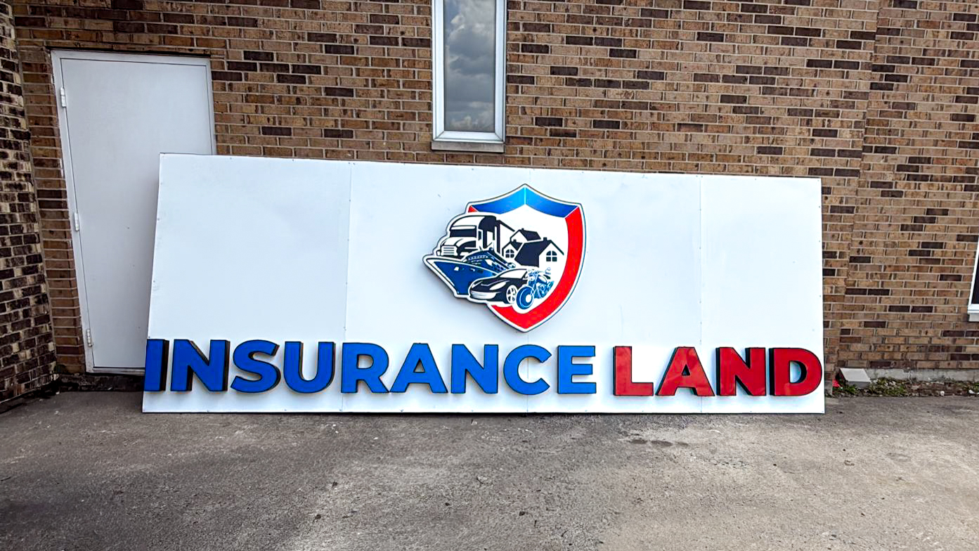 Insurance Land – Blue and red dimensional channel letters with a custom illuminated logo.
