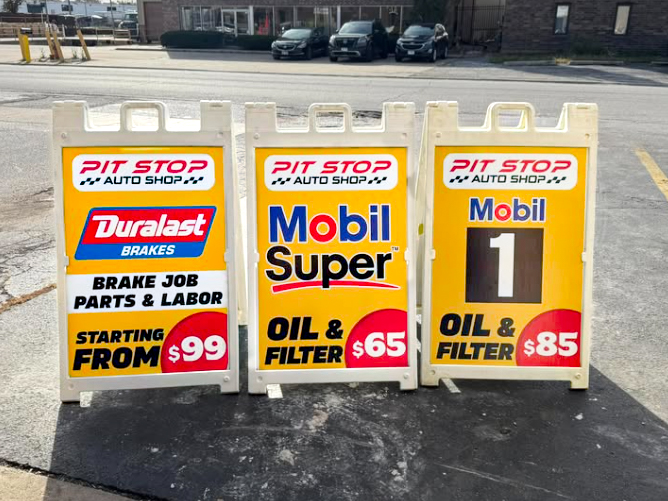 Pit Stop Auto Shop custom promotional sidewalk signs.