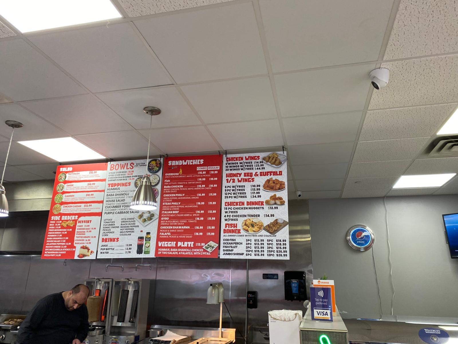 Custom restaurant menu board installed above the service counter