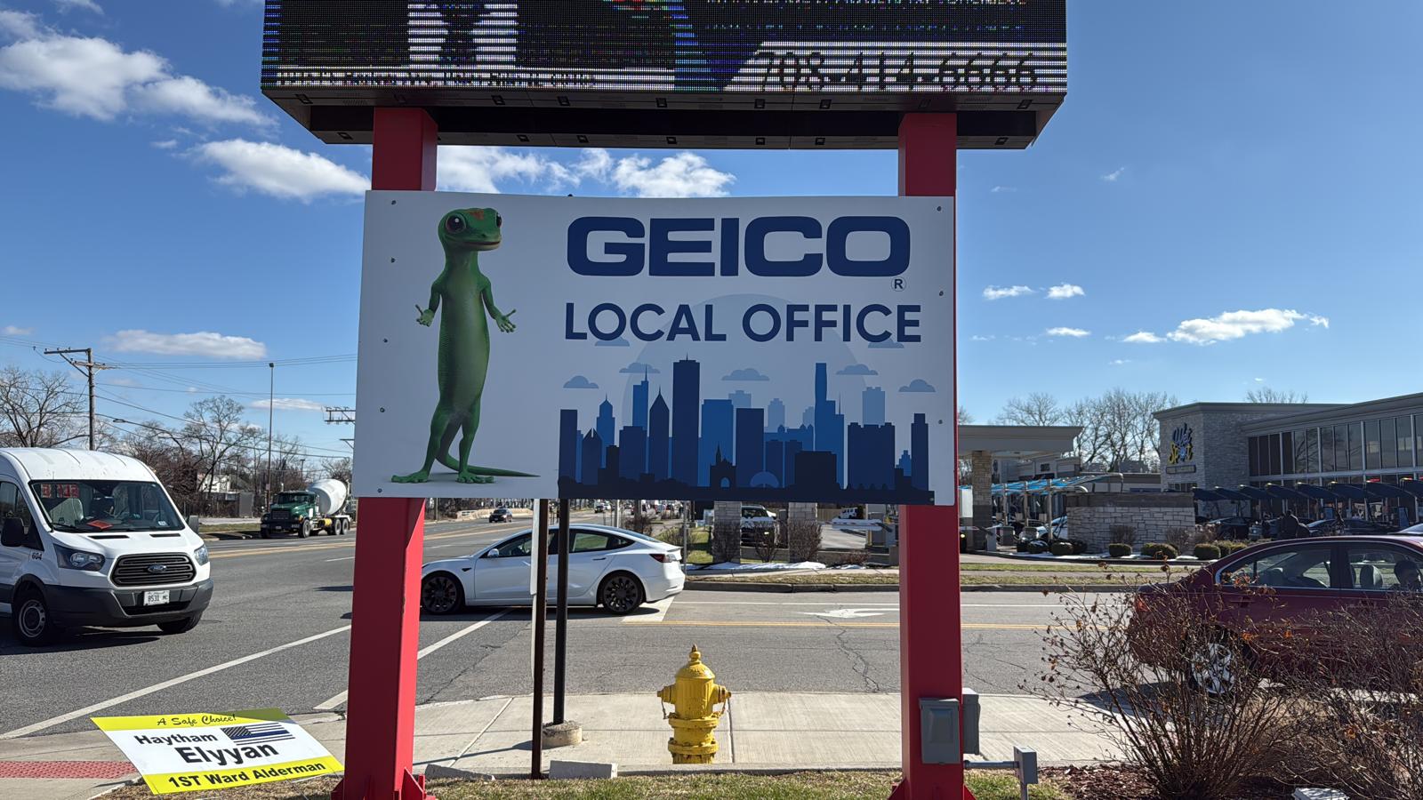 GEICO Local Office custom outdoor sign panel mounted on a roadside structure