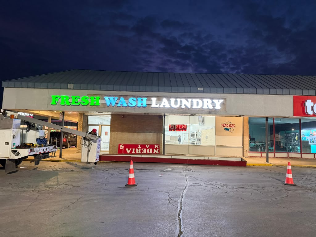 Fresh Wash Laundry illuminated channel letter storefront sign at night