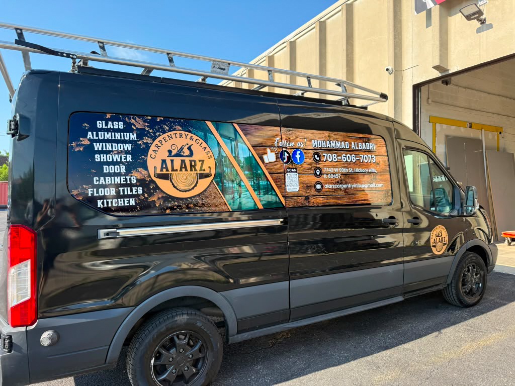 Rear view of the Alarz Carpentry and Glass branded work van