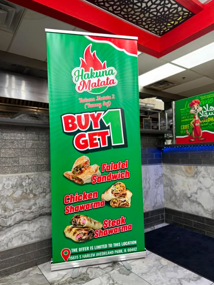 Hakuna Matata promotional roll-up banner displayed inside the restaurant
