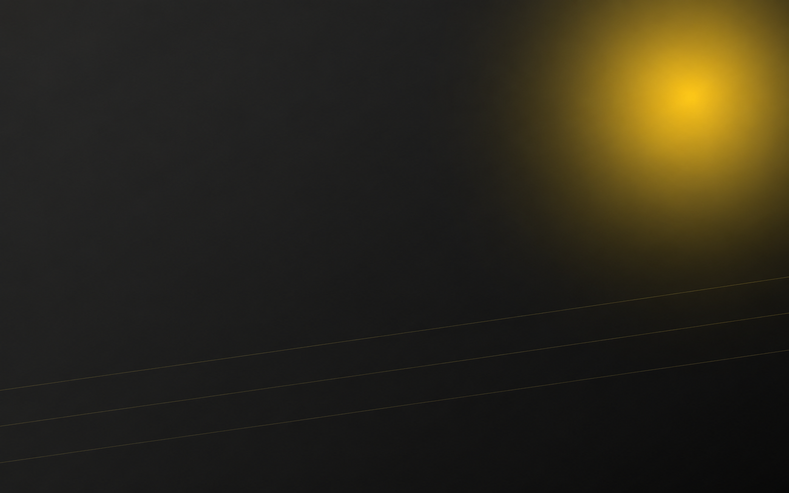 Dark charcoal Signs Corner hero background with a warm yellow illuminated glow