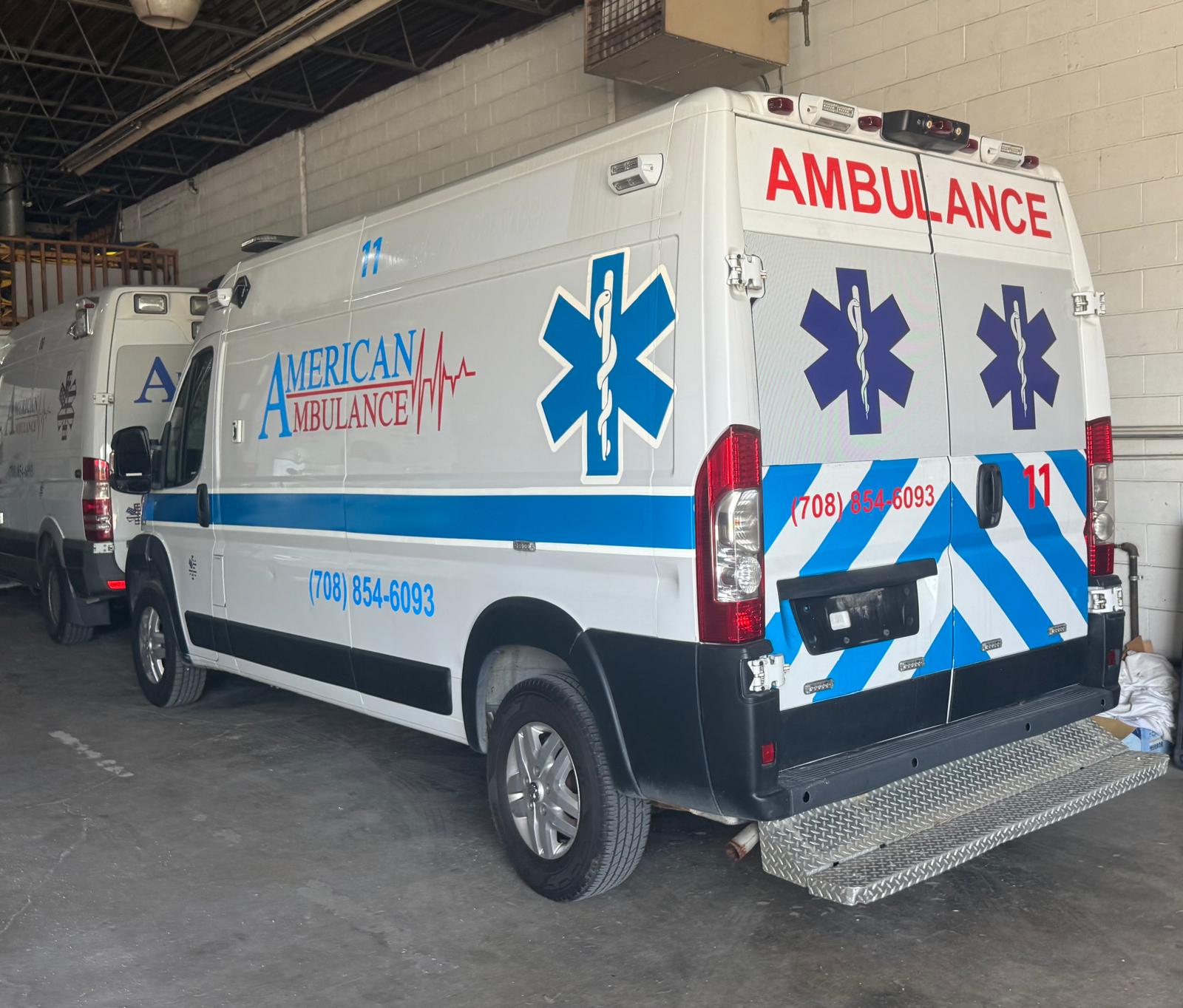 American Ambulance vehicle graphics with blue medical branding and emergency markings