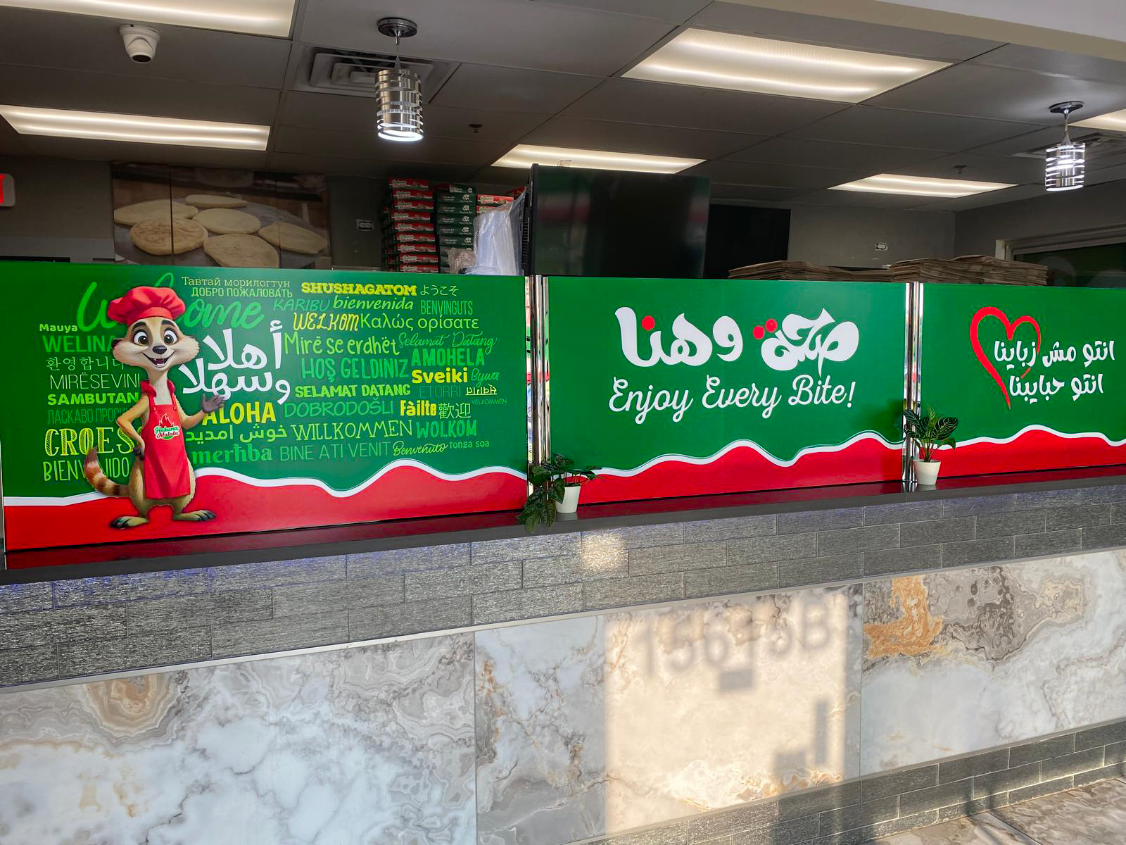 Hakuna Matata restaurant interior with custom branded counter graphics