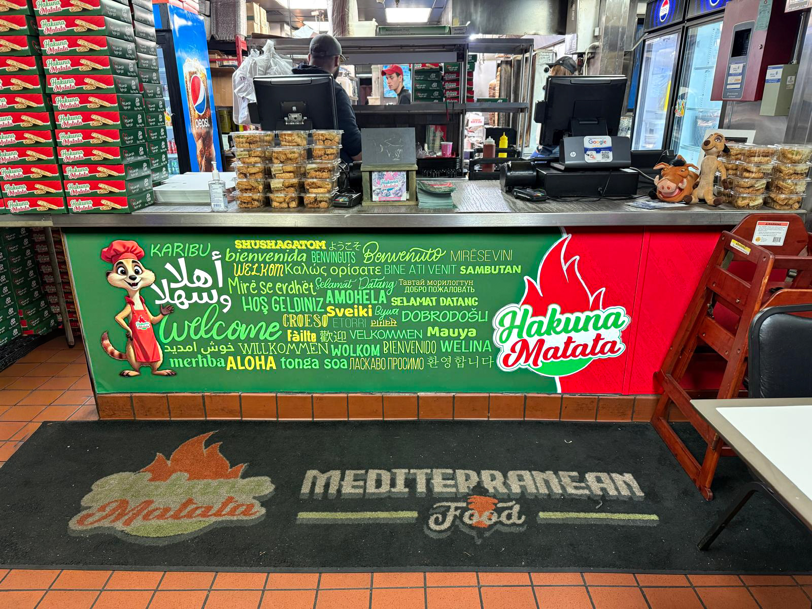 Hakuna Matata restaurant counter with custom branded vinyl graphics