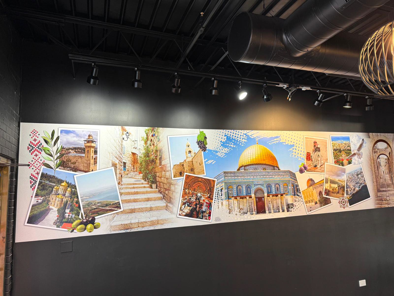restaurant interior with a large custom cultural wall mural.