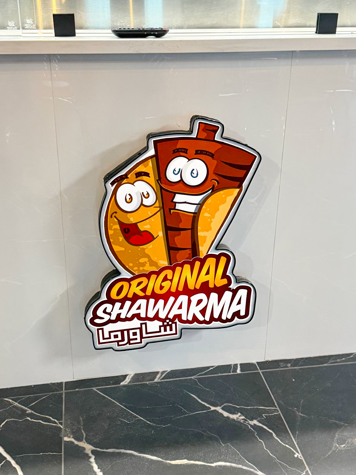 Original Shawarma restaurant interior with custom dimensional wall branding
