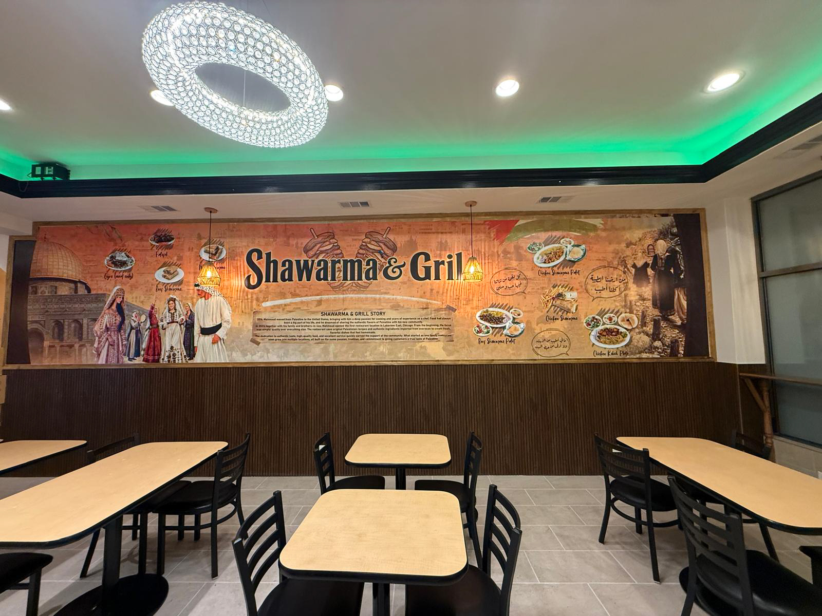 Shawarma & Grill restaurant interior with a large custom cultural wall mural