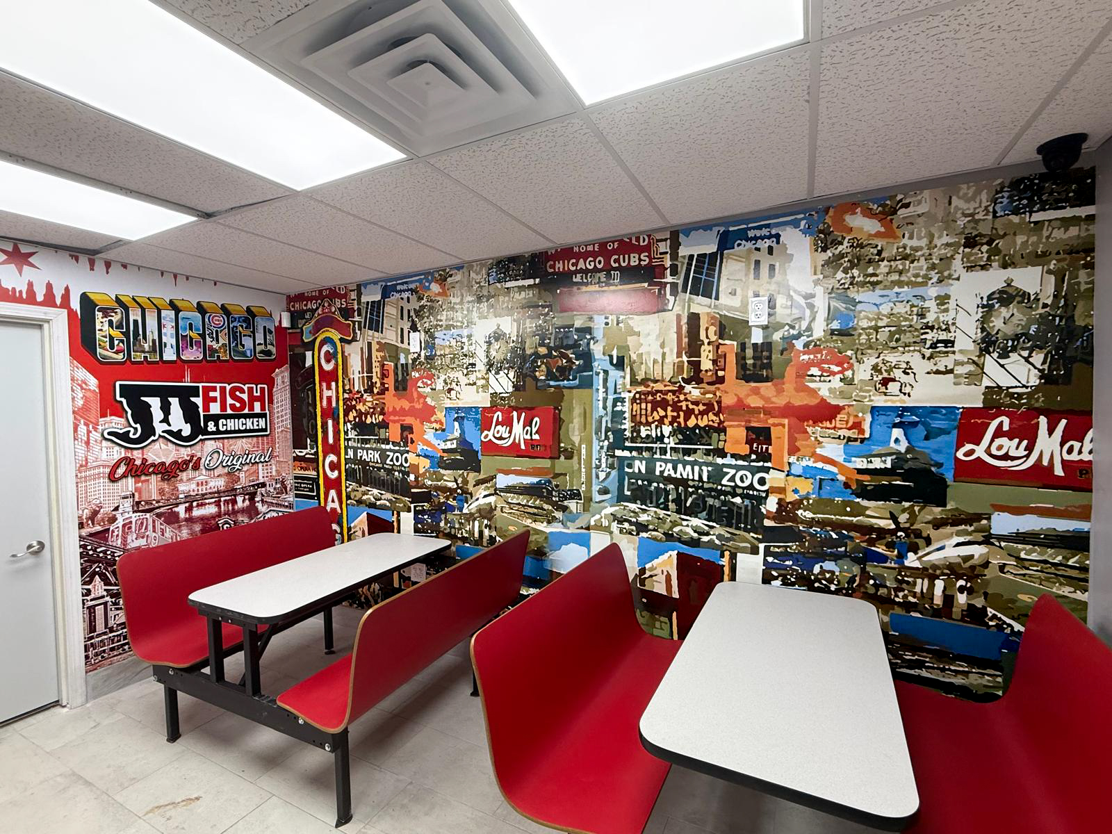JJ Fish and Chicken restaurant interior with a large Chicago themed printed wall mural