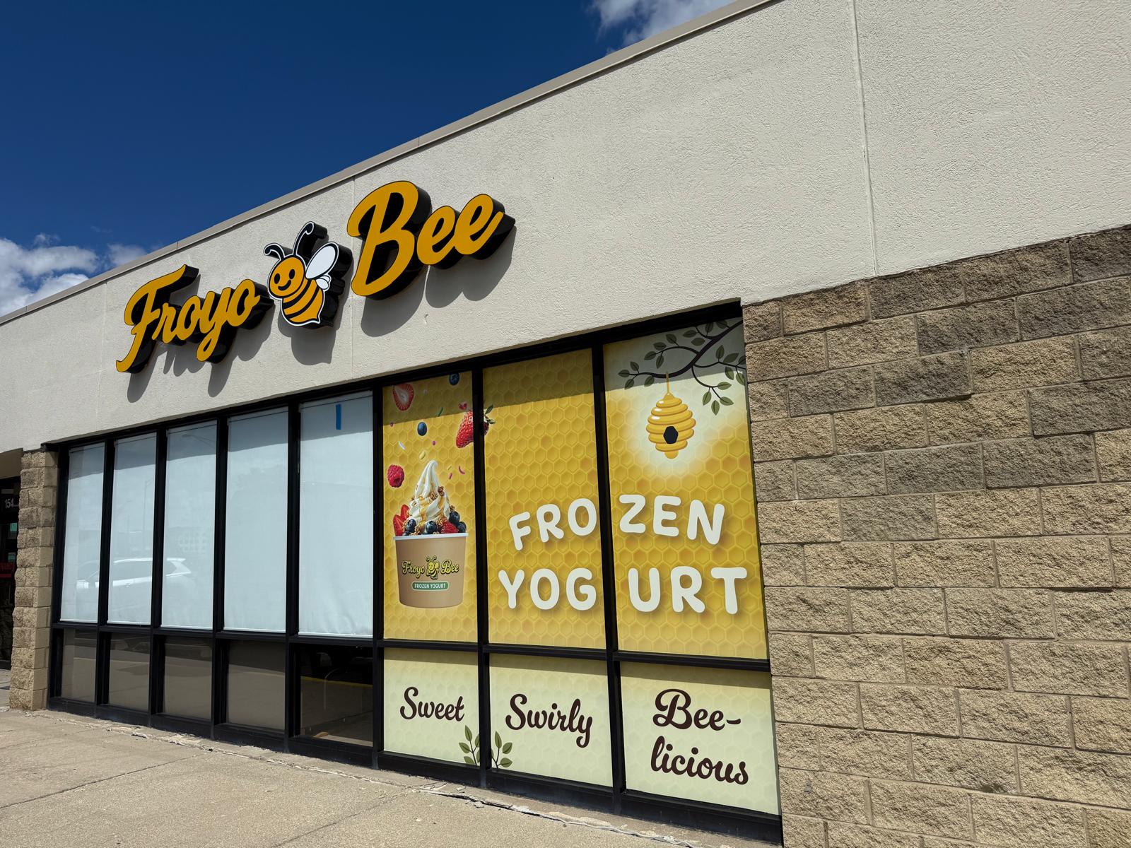 Froyo Bee storefront with custom yellow frozen yogurt window graphics