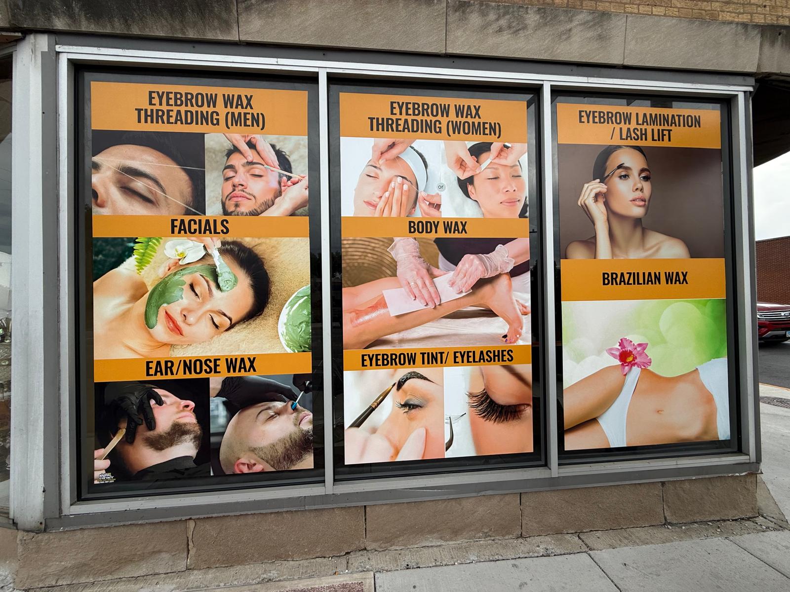 Beauty business storefront windows with custom waxing and beauty service graphics